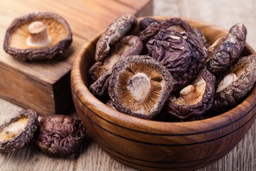 dried shitake mushroom on a wooden table