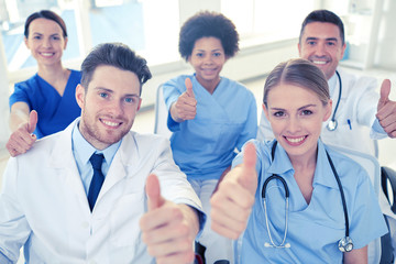 group of happy doctors on seminar at hospital