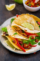 Tacos. Mexican yellow corn tortilla with chicken and vegetables