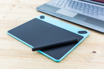 Digital graphic tablet and pen.