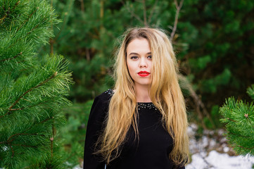 Girl posing in pines