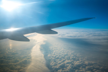 The wing in the sky on the background of the cloud