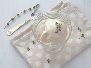 Banana mousse. Soft homemade ice cream. Fresh zabaglione with thyme and vanilla. Custard cream. Top view.