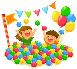 two kids playing in a ball pit with a festive atmosphere