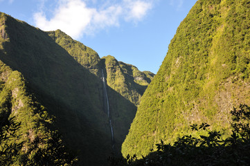 High Waterfall on the Mountains with Vegetation in the Reunion Island