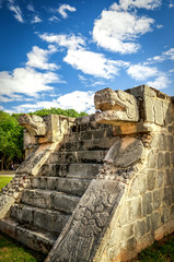 Fototapeta premium Mayan jaguar heads carved in stone at the Venus Platform, Ancient Maya Ruins, Chichen Itza Archaeological Site, Yucatan, Mexico