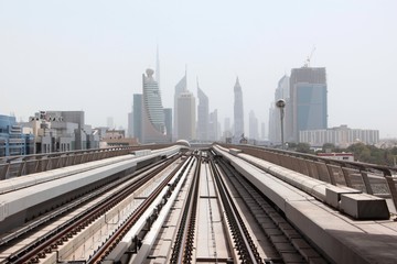Fototapeta na wymiar Dubai metro the forward movement speed of the skyscrapers