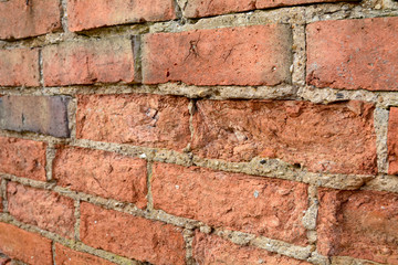 Obraz premium Wall with bricks damaged by the weather