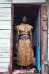 Indigenous Fijian man dressed in traditional Fijian costume