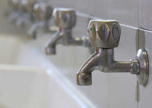 stainless steel taps in a sink of a school for the infancy