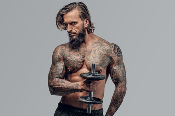 Fototapeta premium Shirtlessmale with holds dumbbell.