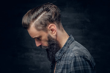 Portrait of bearded male with long hair.
