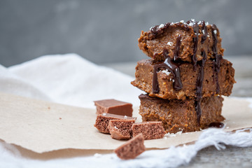 Chocolate pumpkin brownies with slices of chocolate and syrup. Love for a healthy desserts concept.