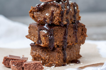 Chocolate pumpkin brownies with slices of chocolate and syrup. Love for a healthy desserts concept.