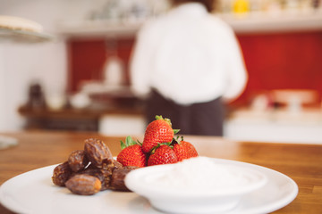 Close up of fresh strawberry and dates