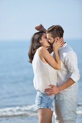 Fototapeta premium young handsome man hold up his beautiful girlfriend