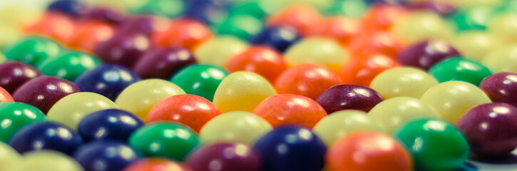 Multi colored pills or bubbles background close up