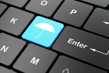 Safety concept: Umbrella on computer keyboard background