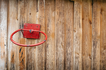 The old basketball ring attached to a wooden wall. The place for the text
