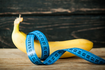 Fresh banana and measuring tape