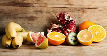 Ripe fresh fruits on wood desk