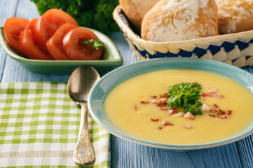 Potato cream soup with cheese and bacon.