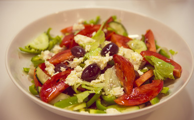 Greek salad with tomatoes, feta cheese and olives