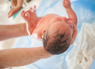 Fototapeta Newborn baby first bath obraz
