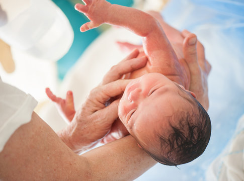 Newborn baby first bath