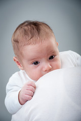 Newborn baby in arms hold