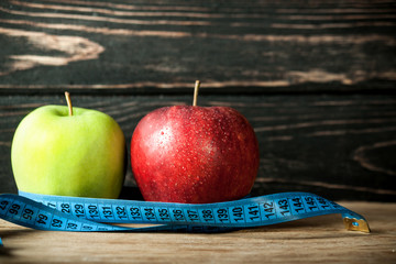 Fresh apple with measuring tape 