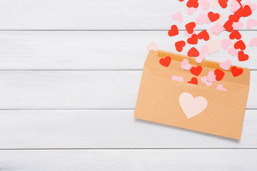 Valentine day love letter on white wood background