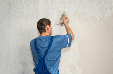 Hands plasterer at work