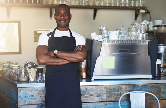 Smiling Black Male Worker Posing In Cafe