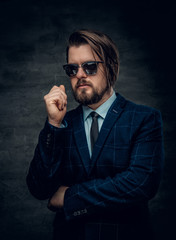 Fototapeta premium A man in a suit and sunglasses.