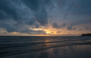 Naklejka na ściany i meble Beautiful view on the ocean beach. Sunset.
