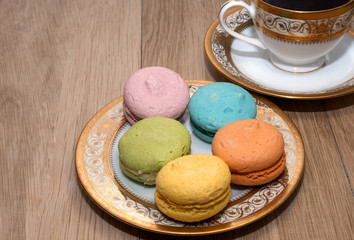 cup of coffee and biscuits on a plate