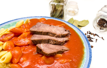Czech traditional homemade food: Tomato sauce (Czech: rajska omacka) with pasta and beef meat