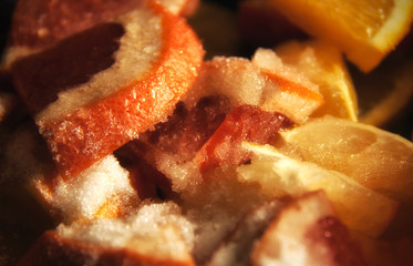 Orange lemon and grapefruit in sugar