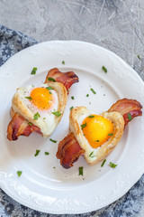 Baked egg breakfast with bacon heart shape for Valentine day