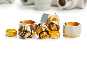Set of metal-plastic plumbing couplings, adapters, plugs isolated on white background