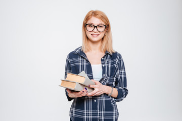 Pretty young lady holding books