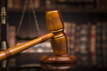 Law books, mallet of the judge, Courtroom background