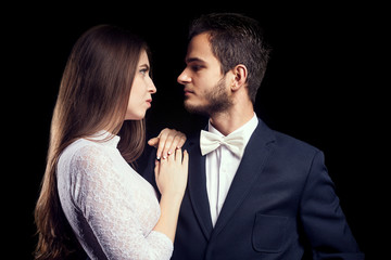 Gorgoeus woman in body lingerie next to man in suit