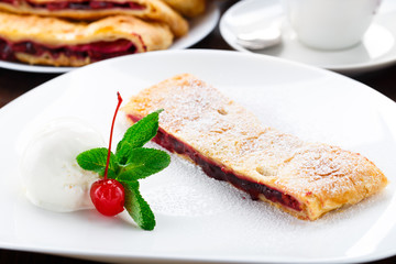 Cherry strudel with vanilla ice cream