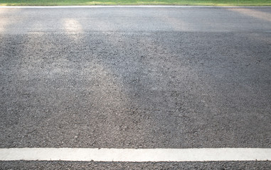 Asphalt background texture with some fine grain with road line