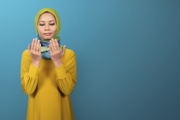 Beautiful asian muslim female praying