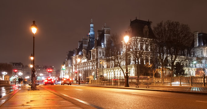 stunning night view from the bridge of Arcole in central Paris,