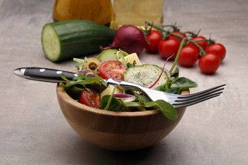Caprese. Caprese salad. Italian salad. Mediterranean salad. Italian cuisine. Mediterranean cuisine. Tomato mozzarella basil leaves black olives and olive oil on wooden table. Recipe - Ingredients
