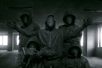 Group of hooded hacker with mask standing